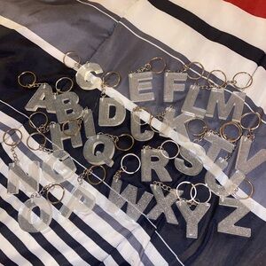 I’m selling letters keychain, you choose any color and I will make one.